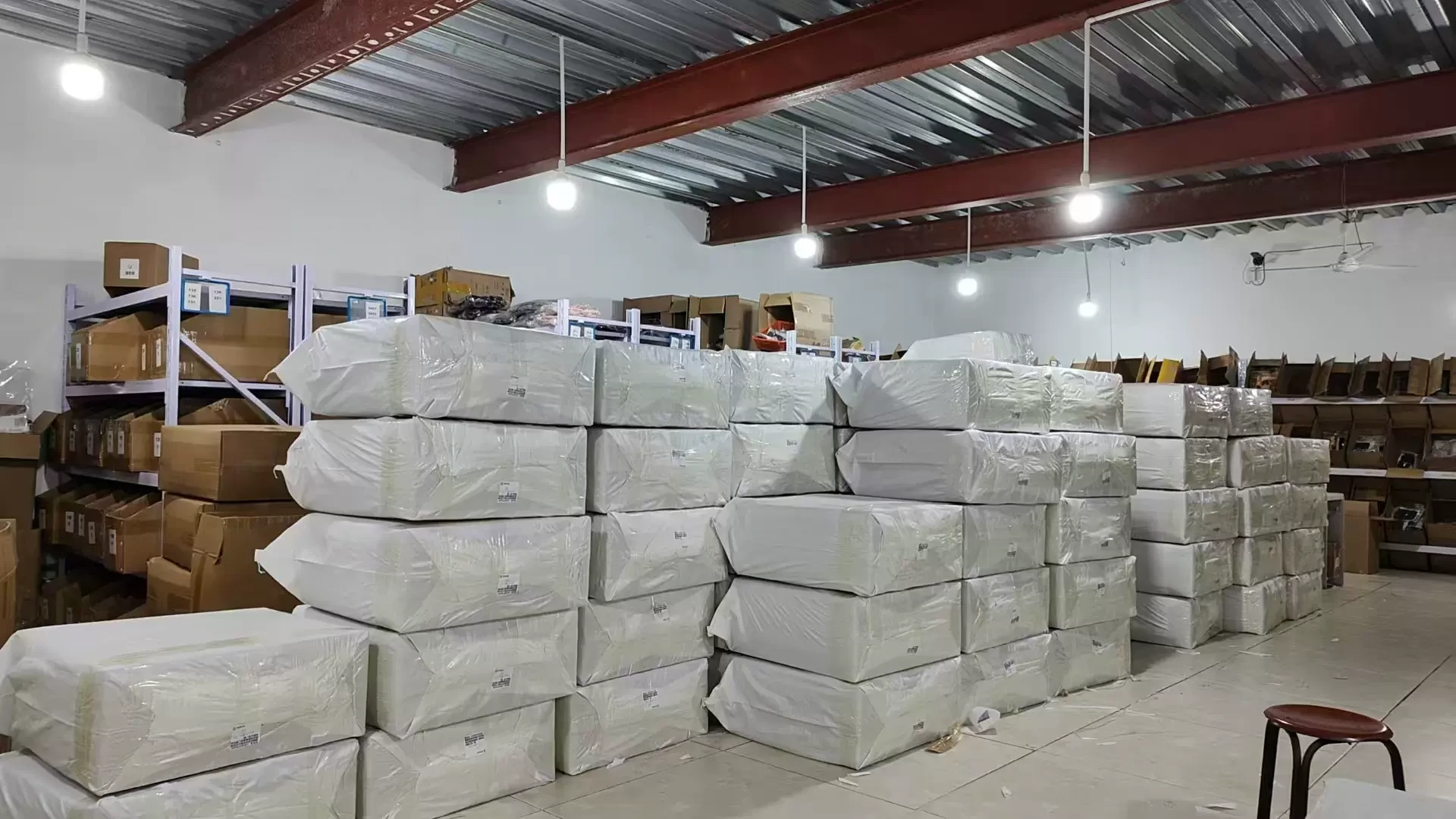 Wrapped bundles stored on warehouse racks