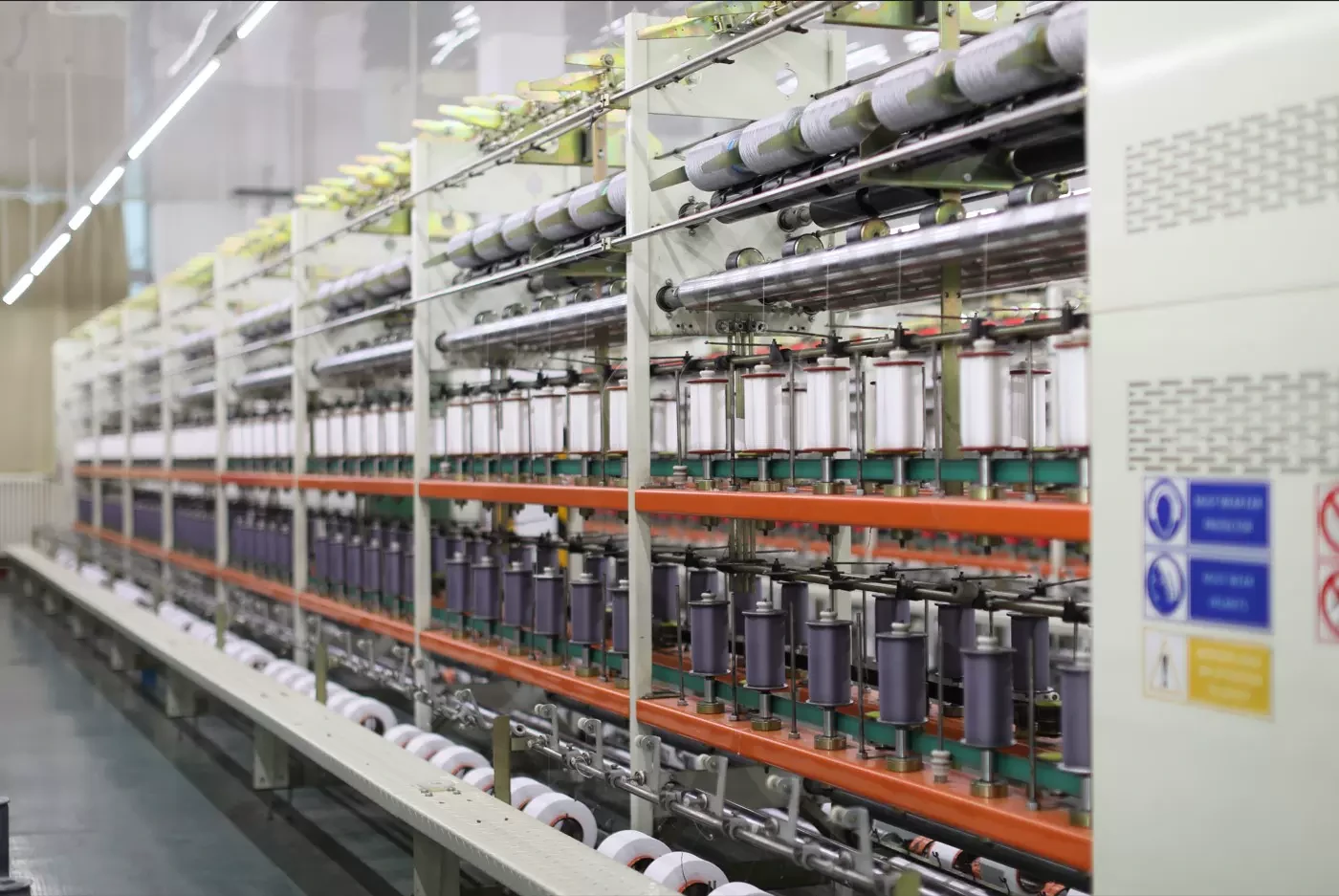 Yarn cones on winding equipment in the preparation area