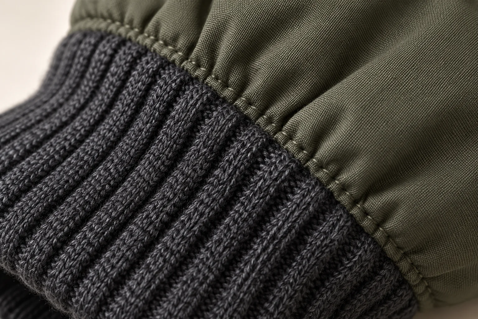 Olive winter glove: macro charcoal rib cuff sewn to olive woven shell.