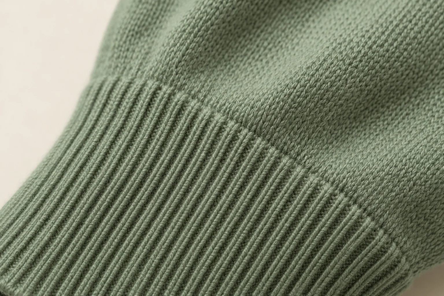 Sage fine-knit glove: macro narrow thin rib cuff transitioning to fine stockinette body.