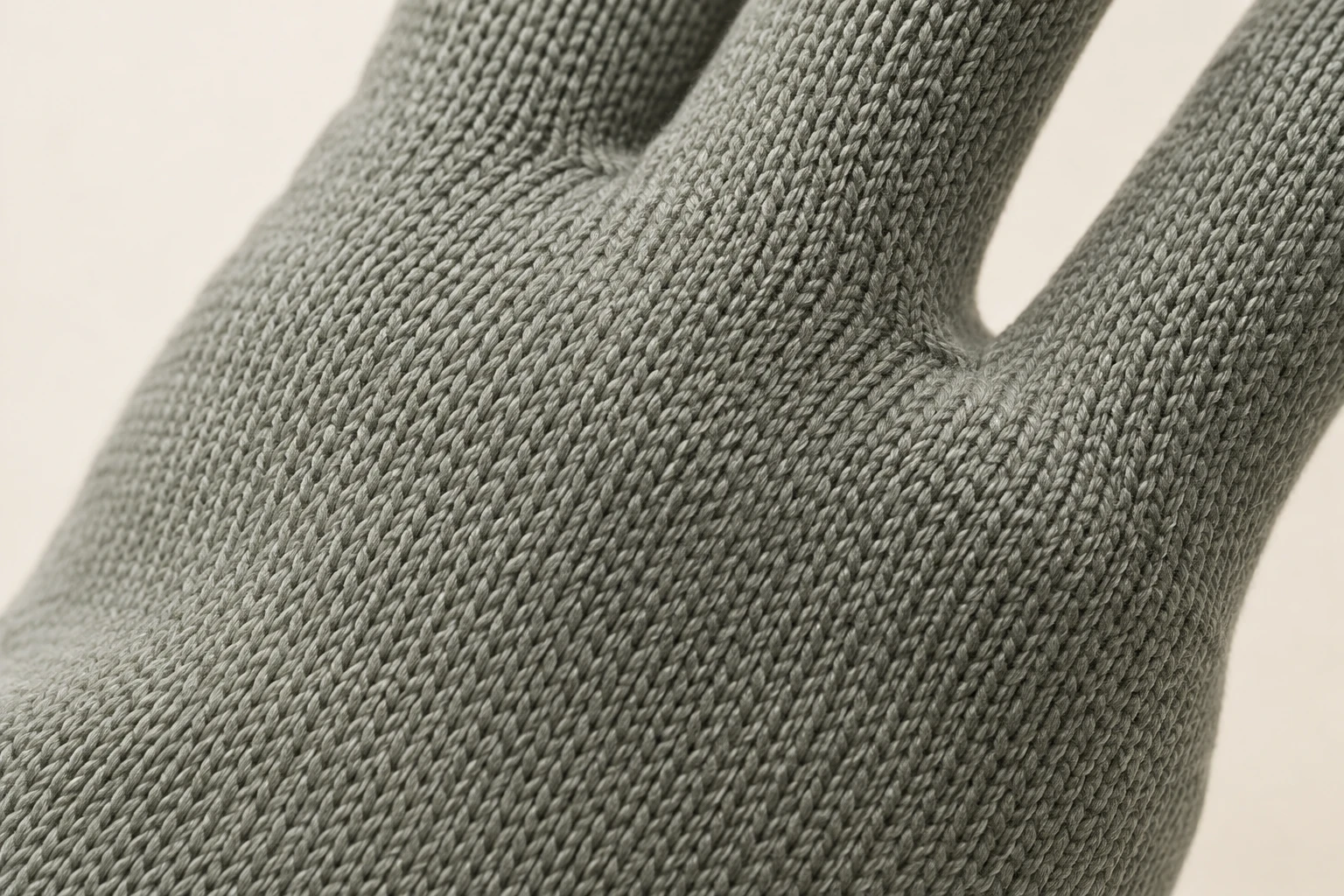 Plain-knit stitches across the glove knuckles